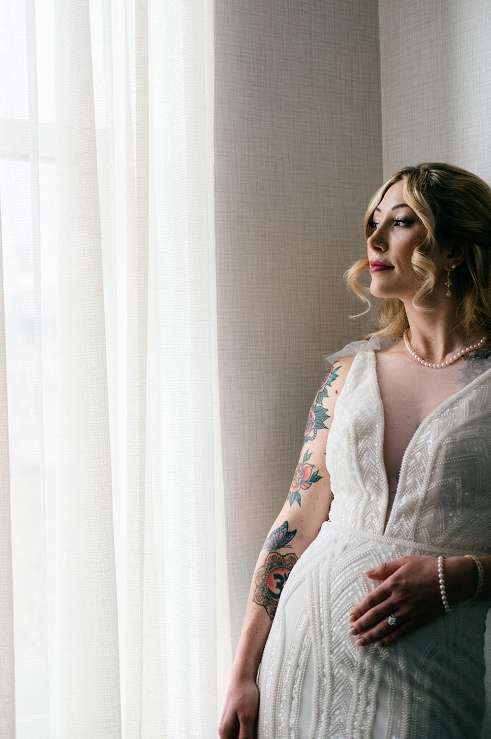 Bride staring out of window