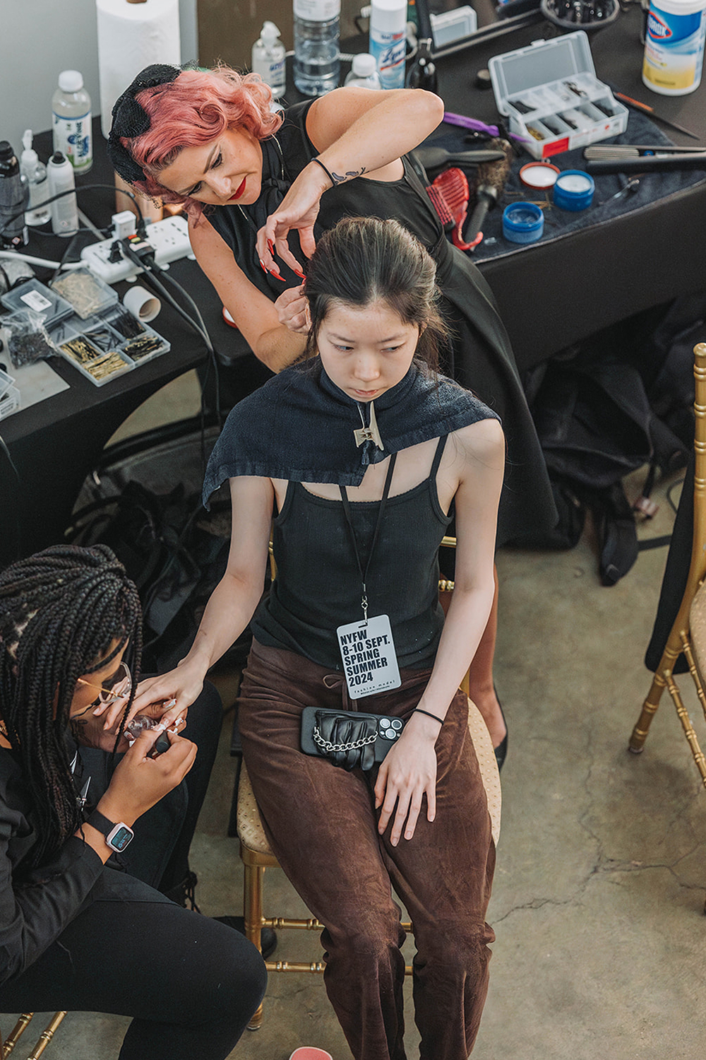Model getting hair and nails done