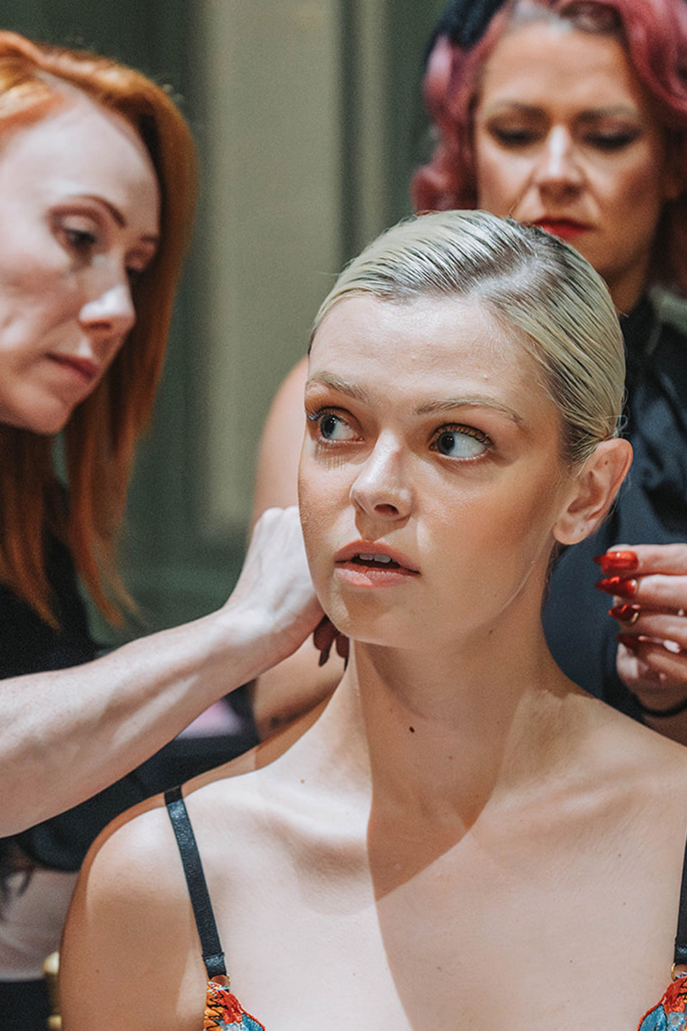 Model getting hair styled