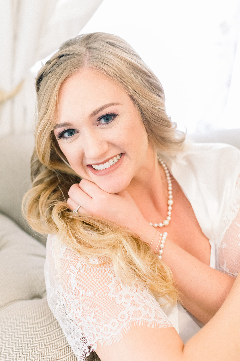 Blonde bride smiling at camera
