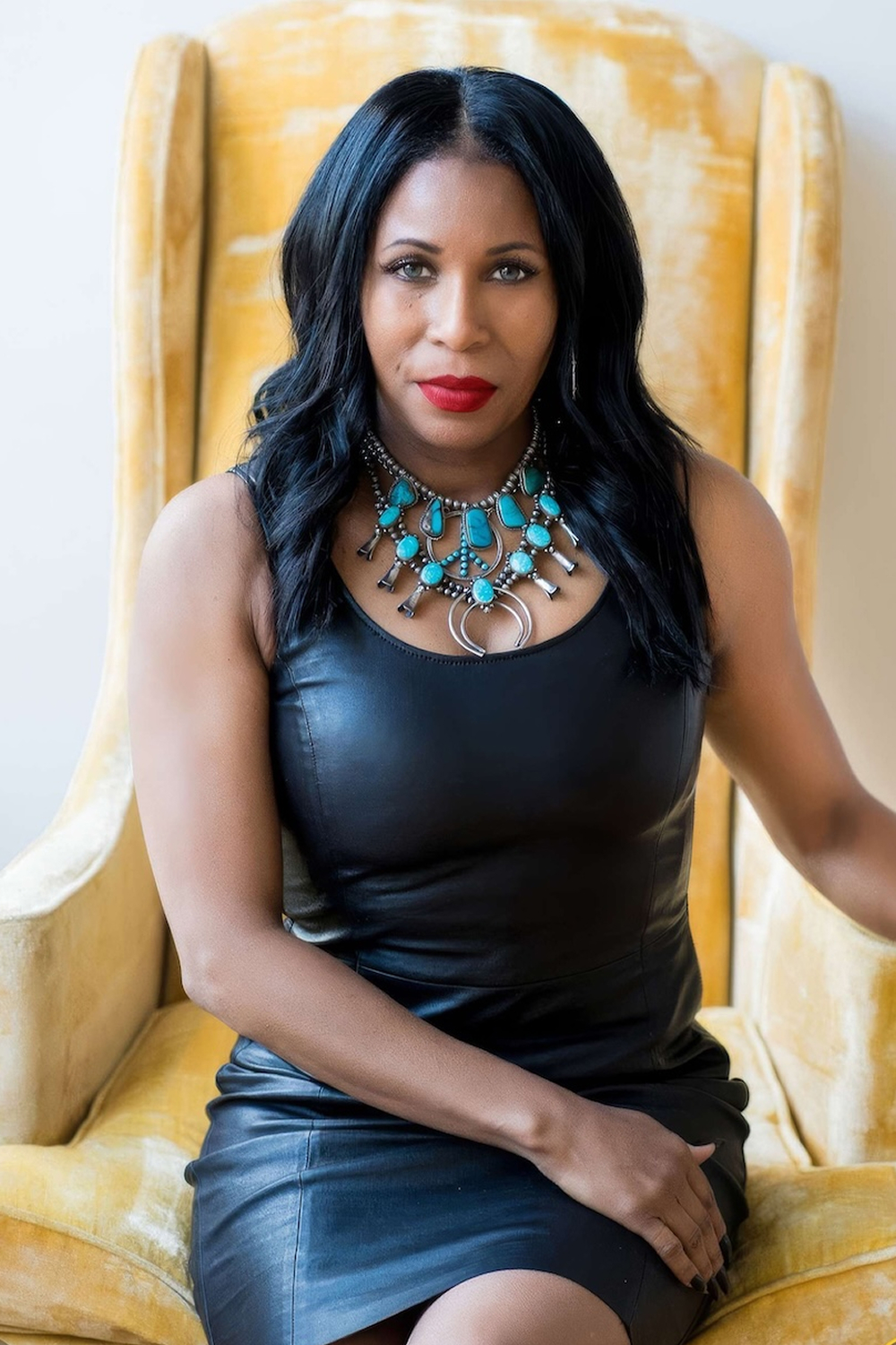 Woman in Black on Yellow Chair